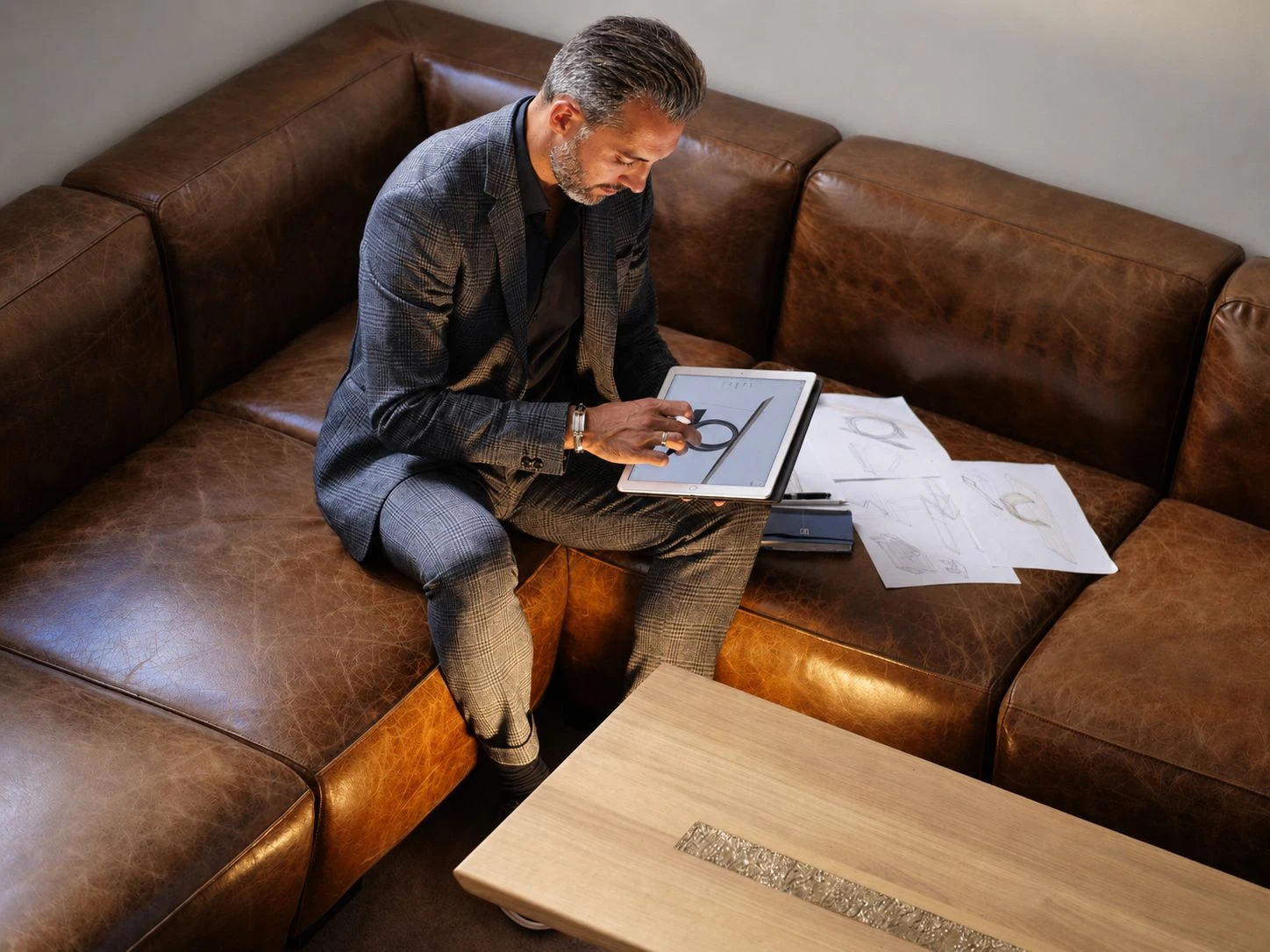 Antoine Jourdan reviewing his furniture designs